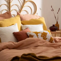 Coussin pompons